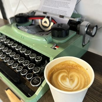 Comma Cafe - a cup of coffee next to a typewriter - Cafes Near Me - Vancouver, British Columbia Comma Cafe - a cup of coffee next to a typewriter - Cafes Near Me - Vancouver, British Columbia