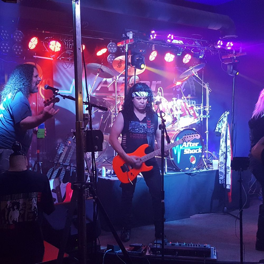 a band performing on stage a band performing on stage
