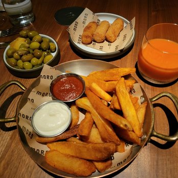 Bar Moro - Top to Bottom, Left to Right: Marinated Olives, Salt Cod Croquetas, Gazpacho, Patatas Bravas - Spanish Near Me - Clayton, Missouri Bar Moro - Top to Bottom, Left to Right: Marinated Olives, Salt Cod Croquetas, Gazpacho, Patatas Bravas - Spanish Near Me - Clayton, Missouri