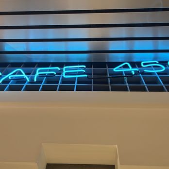 Cafe 450 - a neon sign in a window - Cafeteria Near Me - San Francisco, California