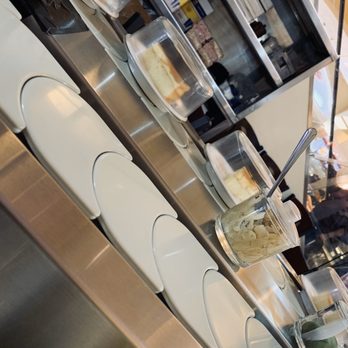 Kido Sushi - Conveyor belt with dessert and other edible items that can be purchased. - Sushi Bars Near Me - Elmhurst, New York