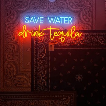 Palenque Kitchen - Neon sign between the restrooms - Cocktail Bars Near Me - Costa Mesa, California