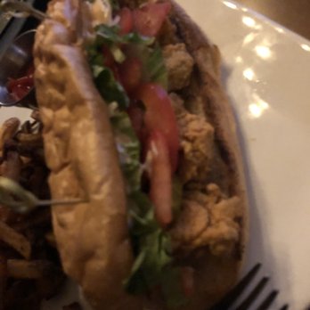 Gaslight Bar & Grill - Oyster po-boy. Dim lit restaurant makes it hard to capture pictures - Salad Near Me - Cincinnati, Ohio Gaslight Bar & Grill - Oyster po-boy. Dim lit restaurant makes it hard to capture pictures - Salad Near Me - Cincinnati, Ohio