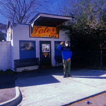 Tater Bread Cafe - a man taking a picture - Cafes Near Me - Durham, North Carolina Tater Bread Cafe - a man taking a picture - Cafes Near Me - Durham, North Carolina