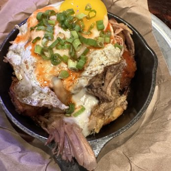 Ole Red - Pulled pork Tots, with egg and green onions on top. - Southern Near Me - Orlando, Florida Ole Red - Pulled pork Tots, with egg and green onions on top. - Southern Near Me - Orlando, Florida