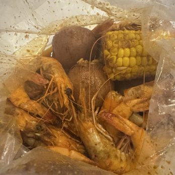 The Boiling Crab - 1 pound shrimp seasoned with the whole sha-bang add corn and potatoes. - Cajun/Creole Near Me - Garden Grove, California The Boiling Crab - 1 pound shrimp seasoned with the whole sha-bang add corn and potatoes. - Cajun/Creole Near Me - Garden Grove, California