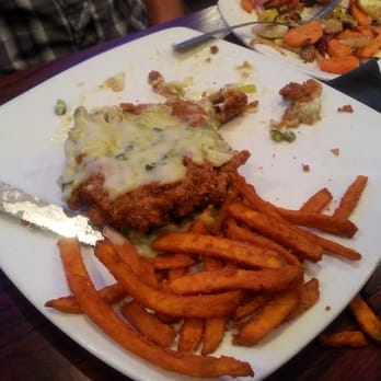 9th Inning Brews and Bites - Chicken Fried Steak...CFS with an awesome Green Chile Cream Gravy and fresh cut Sweet Potato Fries yummiest yum. - American Near Me - Amarillo, Texas