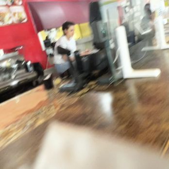 Lupitas Tex-Mex - Employee sitting on the counter on her phone with her shoes on - Tex-Mex Near Me - Lake Worth, Florida Lupitas Tex-Mex - Employee sitting on the counter on her phone with her shoes on - Tex-Mex Near Me - Lake Worth, Florida