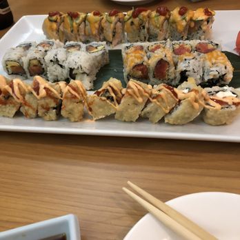 Tokyo Sushi Bar - Middle rolls: Alaskan and Spicy Crunchy Tuna. Top: Yellowtail with jalapeño roll. Bottom: a funny name with Kimchi sauce on top. - Japanese Near Me - Tampa, Florida