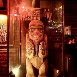 Encased wood carves deity. (?) Encased wood carves deity. (?)
