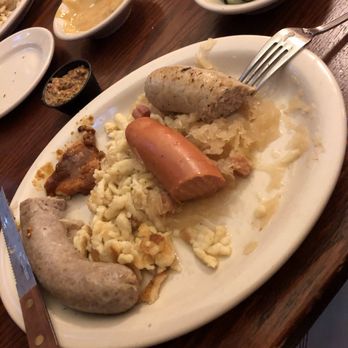 Student Prince - Wurstplatte:  Bratwurst, knackwurst & chef's choice sausage, served with spätzle, red cabbage & sauerkraut - German Near Me - Springfield, Massachusetts