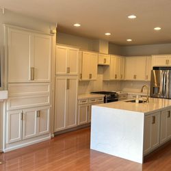 Adval Construction - Custom Reface with Quartz waterfalls