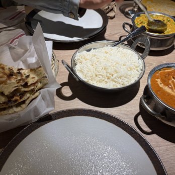 Namaste India Bistro - Our spread of butter garlic naan, butter chicken and Eggplant Curry - Indian Near Me - Monterey, California Namaste India Bistro - Our spread of butter garlic naan, butter chicken and Eggplant Curry - Indian Near Me - Monterey, California