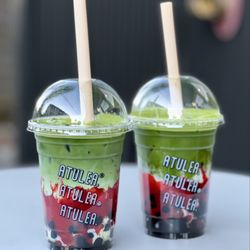 Atulea - The strawberry latte with boba added. They make the strawberry purée in house.