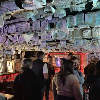 Abe's on Lincoln - Bar area covered in drawings of Abe Lincoln - Pubs Near Me - Savannah, Georgia