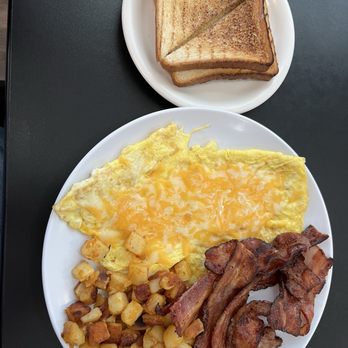 The Poked Yolk - Bacon Lovers with added cheese on the eggs - Breakfast & Brunch Near Me - West Seneca, New York The Poked Yolk - Bacon Lovers with added cheese on the eggs - Breakfast & Brunch Near Me - West Seneca, New York