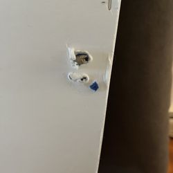 Michaels - The holes where the screws pulled out.