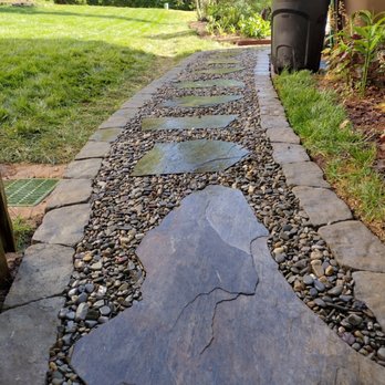 Gaspar Landscaping - a stone path with a water feature - Landscaping Near Me Gaspar Landscaping - a stone path with a water feature - Landscaping Near Me