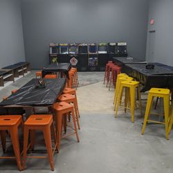 Spinners Pinball Arcade - Party room with a row of arcade 1UP machines.