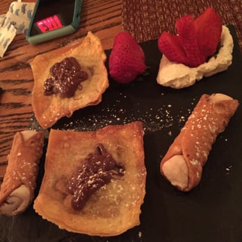 Uva Rossa - What was left of the fried ravioli when I snapped the pic and an order( 3) of mini cannoli's. - Italian Near Me - Malverne, New York Uva Rossa - What was left of the fried ravioli when I snapped the pic and an order( 3) of mini cannoli's. - Italian Near Me - Malverne, New York
