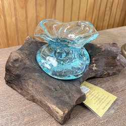 Unique vase nestled into wood.