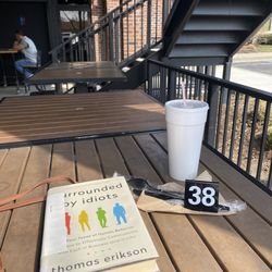 DJ'S Pizza Pub - Enjoying the patio while waiting for my deluxe pizza by the slice. #goodreading