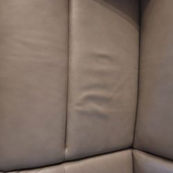 Beck's Furniture & Sleep - They consider loose fabric on a leather couch that is 9 months old "normal wear".