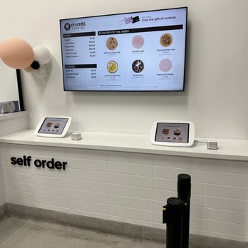 Crumbl - Dewitt - a self - order counter with ipads - Bakeries Near Me - Syracuse, New York