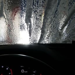 the dashboard of a car in the rain