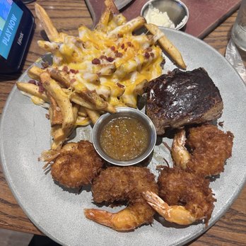 Outback Steakhouse - 6oz steak with coconut shrimp and Aussie fries - Steakhouses Near Me - Altamonte Springs, Florida Outback Steakhouse - 6oz steak with coconut shrimp and Aussie fries - Steakhouses Near Me - Altamonte Springs, Florida