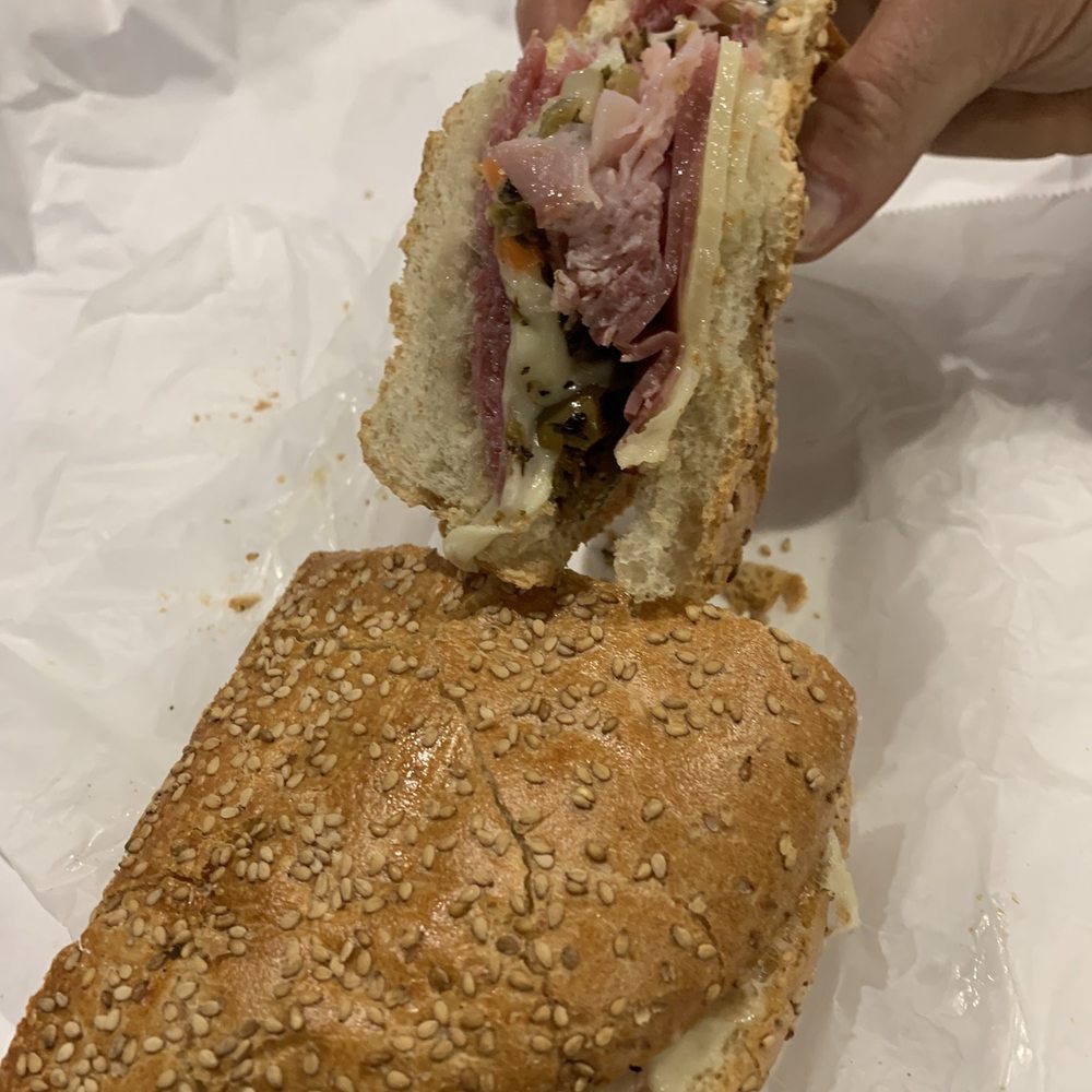 a ham sandwich being cut in half a ham sandwich being cut in half