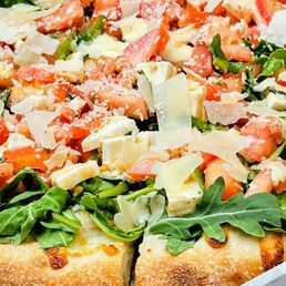 Arugula Pie. Personal size. Huge and delicious!