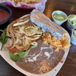 Pollo Ala Plancha chips and various salsas and toppings from the bar