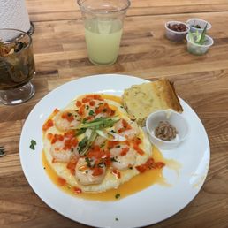Shrimp and grits in an amazing lobster veloute sauce, spiced up collard greens, and cornbread with cinnamon butter that is just to die for. Shrimp and grits in an amazing lobster veloute sauce, spiced up collard greens, and cornbread with cinnamon butter that is just to die for.