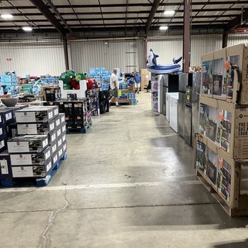 Addicted 2 Deals - A large warehouse store with shelves and pallets of products, including appliances and outdoor items, visible in the space. - Outlet Stores Near Me - Bristol, Wisconsin