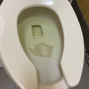 Dunkin' - an example of what the toilets typically look like. - Donuts Near Me - Clermont, Florida