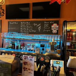 a bar with a lot of bottles a bar with a lot of bottles