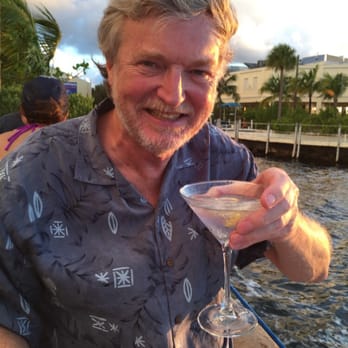 Sundowners - Enjoying a martini in the light rain while watching the sunset. - Seafood Near Me - Key Largo, Florida Sundowners - Enjoying a martini in the light rain while watching the sunset. - Seafood Near Me - Key Largo, Florida