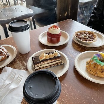 Mozart's Coffee Roasters - A Mini King Cake, a Red Velvet cupcake, an Opera Cake, a Pecan pie, and a cinnamon roll. - Coffee & Tea Near Me - Austin, Texas Mozart's Coffee Roasters - A Mini King Cake, a Red Velvet cupcake, an Opera Cake, a Pecan pie, and a cinnamon roll. - Coffee & Tea Near Me - Austin, Texas