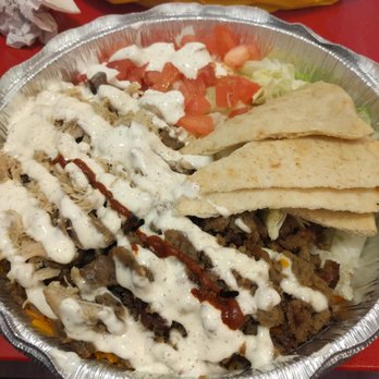 The Halal Guys - The combo in regular amount of white sauce. - Halal Near Me - Davie, Florida The Halal Guys - The combo in regular amount of white sauce. - Halal Near Me - Davie, Florida