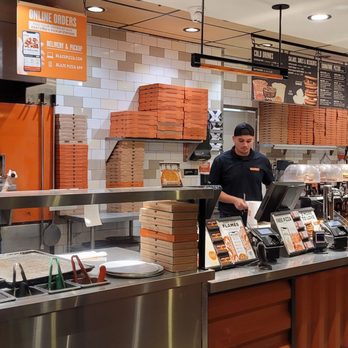 Blaze Pizza - a man working behind the counter - Salad Near Me - Palm Desert, California Blaze Pizza - a man working behind the counter - Salad Near Me - Palm Desert, California