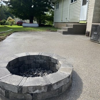 Bergman Services - a concrete patio with a fire pit - Excavation Services Near Me Bergman Services - a concrete patio with a fire pit - Excavation Services Near Me