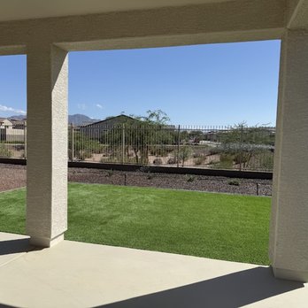 Advance Landscape Design - House back artificial grass, stone and olive trees - Landscaping Near Me - Litchfield Park, Arizona Advance Landscape Design - House back artificial grass, stone and olive trees - Landscaping Near Me - Litchfield Park, Arizona