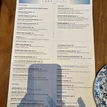 Lakeside - a table with a menu and a plate of food - American Near Me - Orlando, Florida Lakeside - a table with a menu and a plate of food - American Near Me - Orlando, Florida