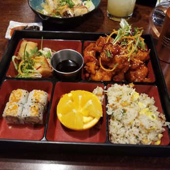 Lucky AF - Lunch bento - sesame chicken, fried rice, orange, sushi , and a shrimp spring roll. - Asian Fusion Near Me - Richmond, Virginia Lucky AF - Lunch bento - sesame chicken, fried rice, orange, sushi , and a shrimp spring roll. - Asian Fusion Near Me - Richmond, Virginia