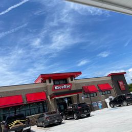 cars parked in front of a racetrac store