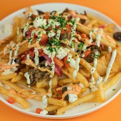 Santorini's - The Zeus at Santorini's Riverton: Award-winning fries topped with gyro meat, feta, and Doner Aioli.