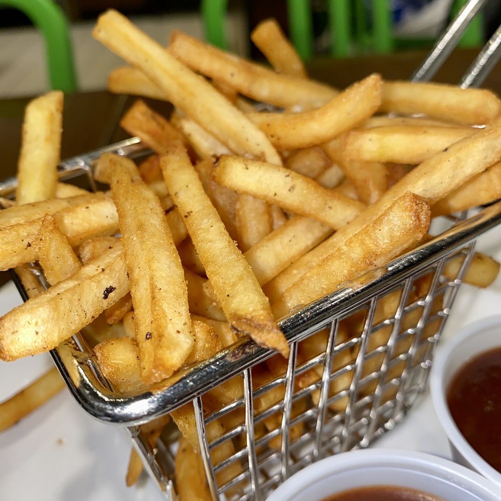 Wahlburgers - a basket of fries with ketchup - Burgers Near Me - Toronto, Ontario Wahlburgers - a basket of fries with ketchup - Burgers Near Me - Toronto, Ontario