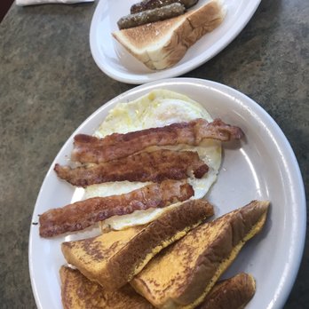 Mr. Beenz Diner - Short stack French toast, two over medium eggs, toast, bacon and sausage links. Delicious! - Diners Near Me - Rochester, New York