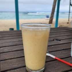 The Palms at Pelican Cove - View of a painkiller from the front veranda.